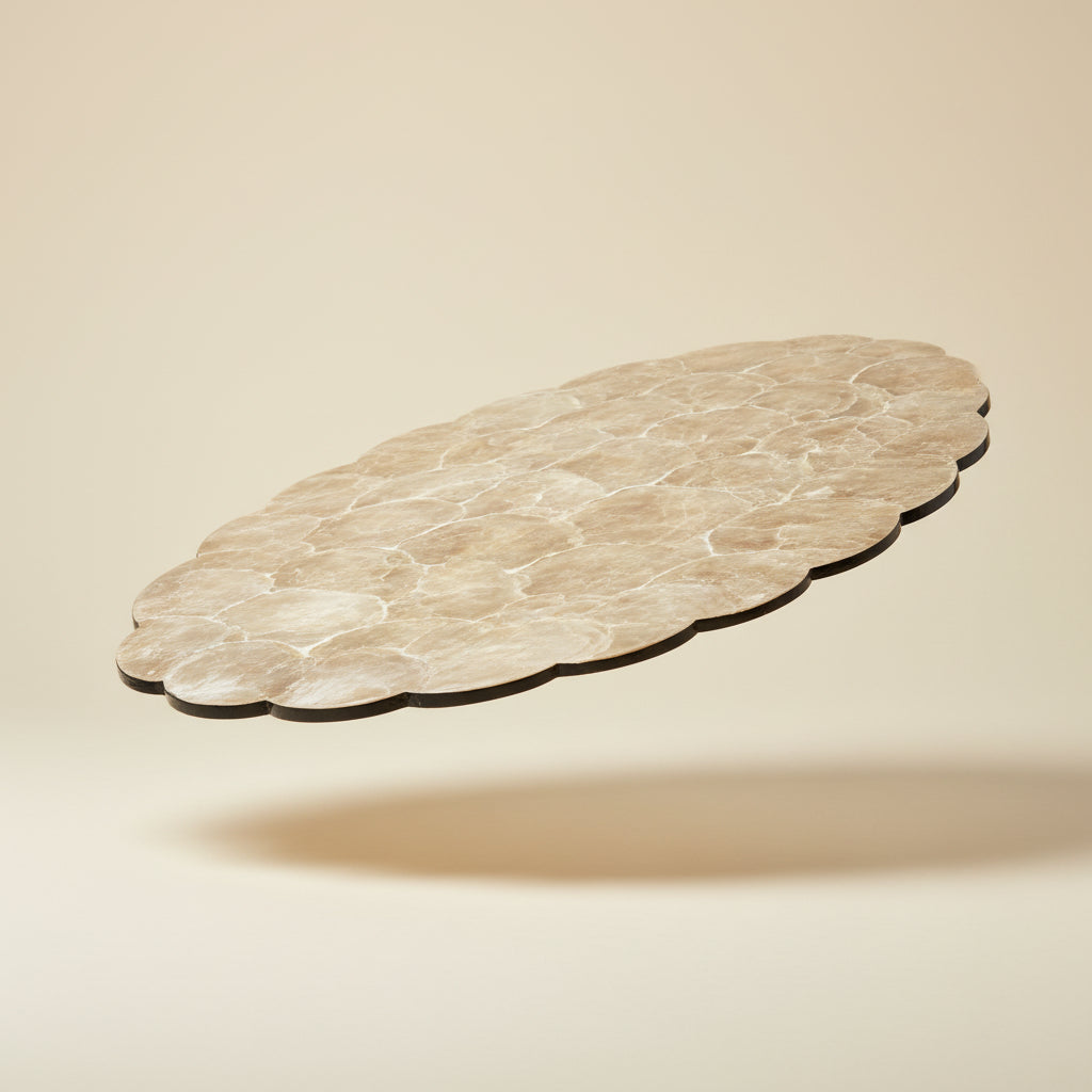 Handcrafted placemat featuring layered mother-of-pearl shell with soft natural iridescent finish by Lumora Luxe