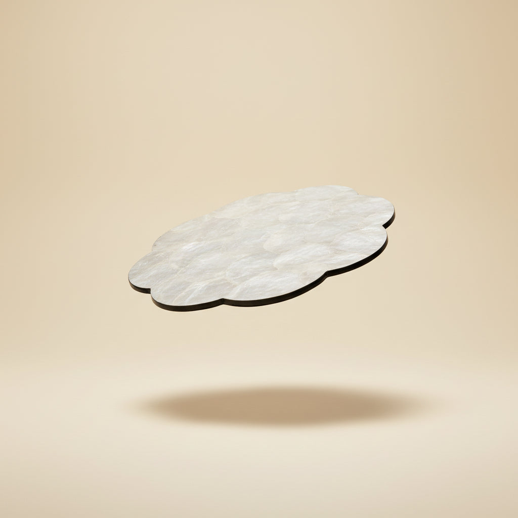 Handcrafted placemat featuring layered mother-of-pearl shell with soft natural iridescent finish by Lumora Luxe
