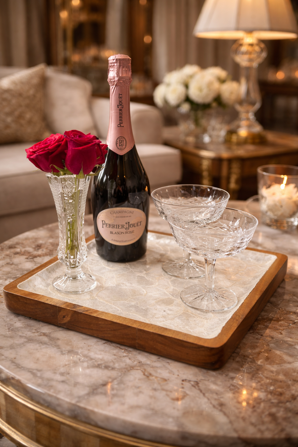 Champagne with glasses on a marble tray in a luxurious living room.